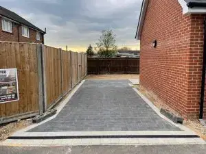 ProPatch Driveways: Gray Block Paving with Decorative Borders and Drainage.