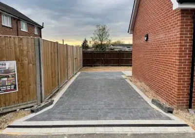 ProPatch Driveways: Gray Block Paving with Decorative Borders and Drainage.
