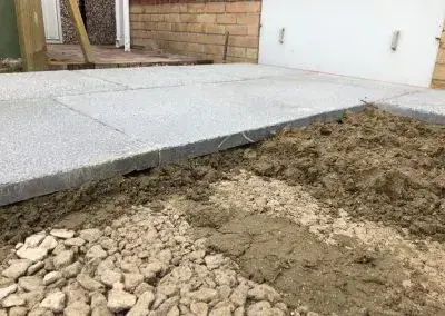 Pro Patch Patio Installation Services: Gray Paving Slab Installation in Progress