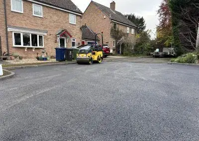 Yellow Bomag Roller on New Asphalt | Pro Patch Ltd